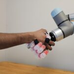 robot and human shake hands
